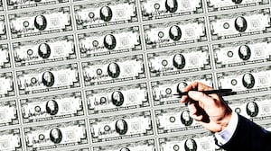 Donald Trump putting his autograph on money.