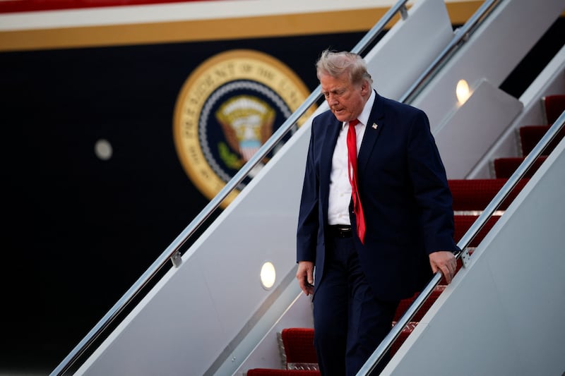 U.S. President Donald Trump deboards the plane as he arrives at Joint Base Andrews in Maryland, U.S., July 19, 2026.