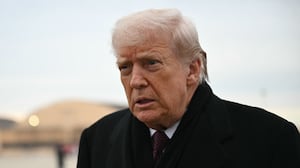 US President Donald Trump speaks to reporters after stepping off Air Force One at Joint Base Andrews on December 17, 2025 upon return from Dover Air Force Base in Delaware where he attended a ceremony for the return of the remains of two Iowa National Guard members and a translator killed in an attack in Syria.