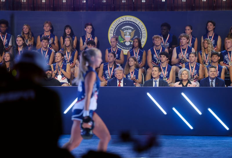 U.S. President Donald Trump, White House Chief of Staff Susie Wiles, and U.S. Senator Bernie Moreno (R-OH) attend the 2026 Patriot Games final at SPIRE Academy in Geneva, Ohio, U.S., August 11, 2026. REUTERS/Kylie Cooper