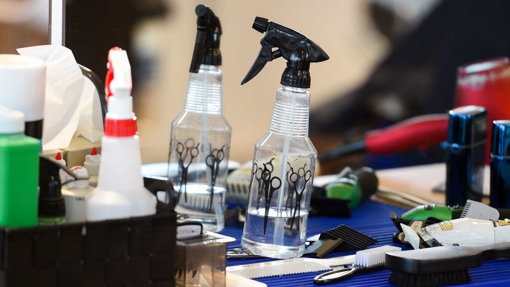 A detail photo of various barber tools on the counter.