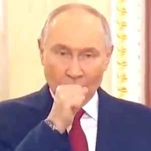 President Vladimir Putin seen coughing.