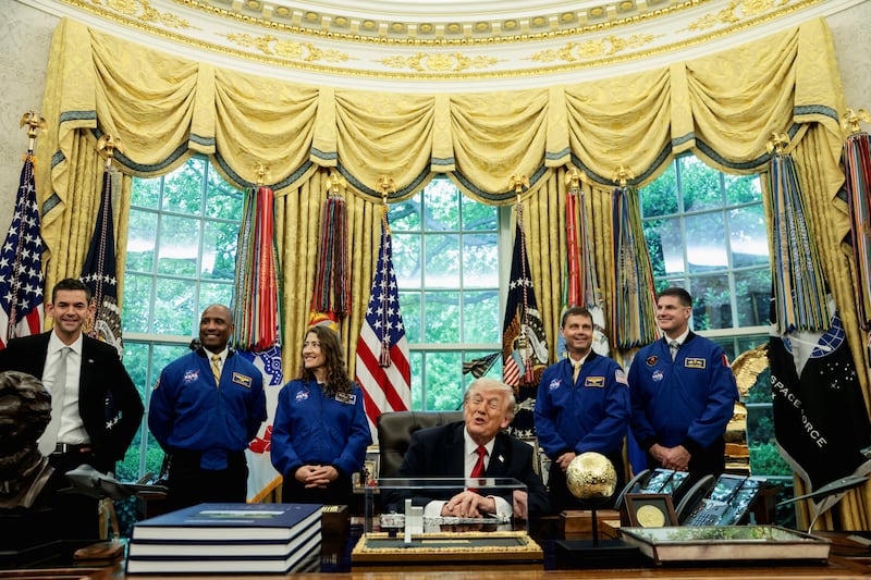 NASA Administrator Jared Isaacman and Artemis II astronauts, NASA Commander Reid Wiseman, NASA Pilot Victor Glover, NASA Mission Specialist Christina Koch and Canadian Space Agency (CSA) Mission Specialist Jeremy Hansen, react along with U.S. President Donald Trump during an event in the Oval Office at the White House in Washington, D.C., U.S., April 29, 2026. REUTERS/Evelyn Hockstein