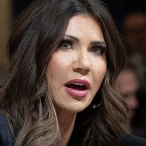 DHS Secretary Kristi Noem, left, and Laura Loomer, right.