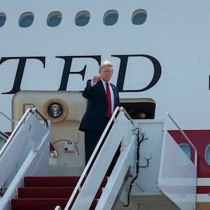 U.S. President Donald Trump gestures as he boards the new Air Force One, a plane gifted by the Qatari government, at Joint Base Andrews, Maryland, U.S., July 1, 2026. REUTERS/Evan Vucci       TPX IMAGES OF THE DAY