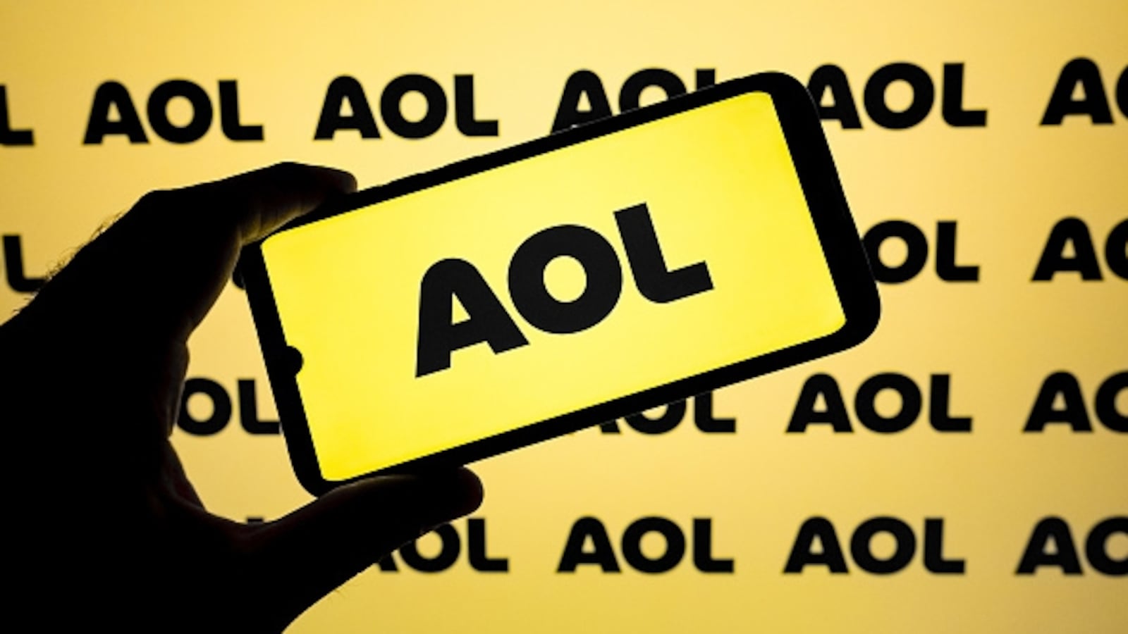 The AOL logo appears on a smartphone screen.