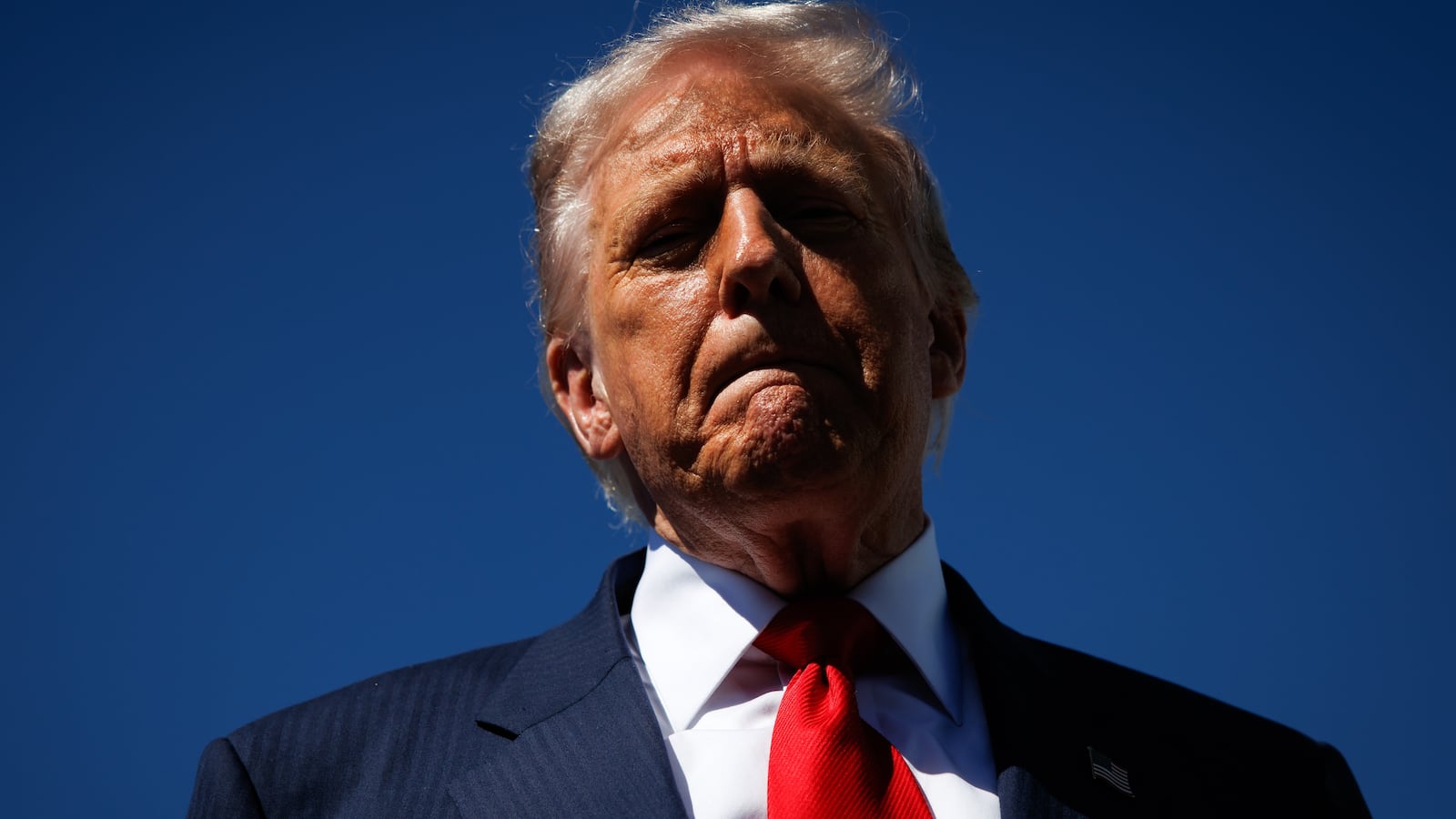 President Donald Trump speaks to reporters as he arrives at Palm Beach International Airport on October 31, 2025 in West Palm Beach, Florida.
