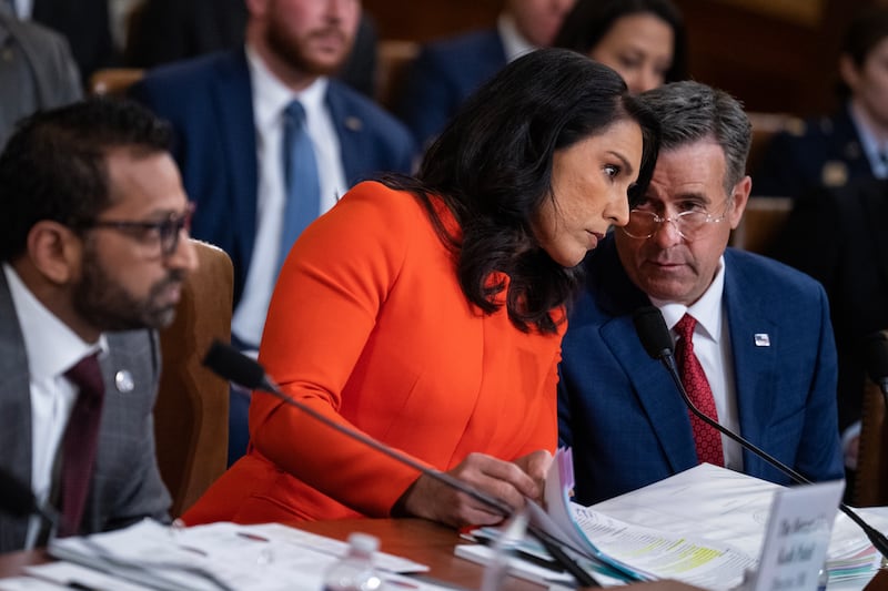 CIA Director John Ratcliffe (left) reports to Gabbard, as do the heads of several other intelligence agencies. Sen. Wyden expressed alarm at CIA activities in a letter to Ratcliffe on Wednesday.