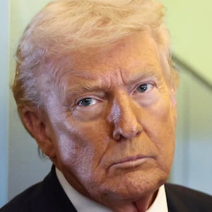 U.S. President Donald Trump, with Secretary of Defense Pete Hegseth at his side, looks on as he speaks to reporters aboard Air Force One on a flight from Dover, Delaware, to Miami, Florida, U.S., March 7, 2026. REUTERS/Kevin Lamarque     TPX IMAGES OF THE DAY