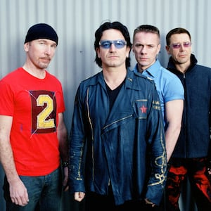 The Edge, Bono, Larry Mullen Jr., and Adam Clayton of U2 pose in a portrait on April 7, 2001, in Los Angeles.