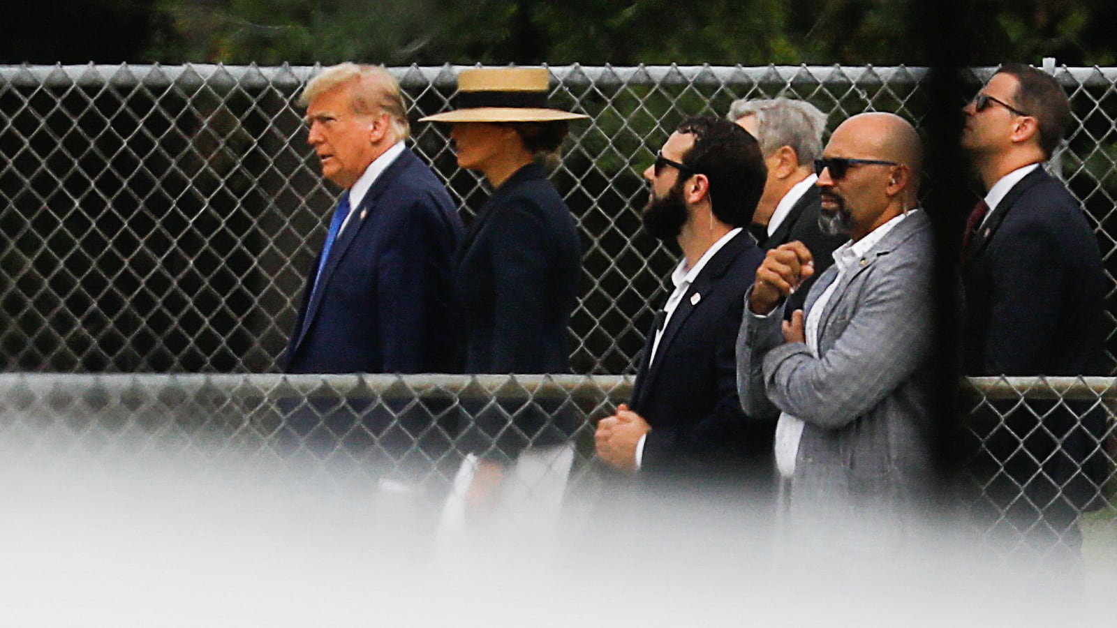 Former U.S. President Donald Trump walks with his wife Melania, as they attend the graduation ceremony of their son Barron Trump, in West Palm Beach, Florida, U.S. May 17, 2024.