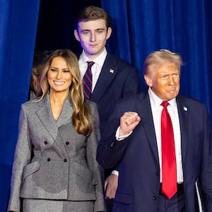 Republican presidential nominee former President Donald Trump arrives to his election night party alongside his wife, Melania Trump, and his son, Barron Trump, at the Palm Beach County Convention Center on Tuesday, Nov. 5, 2024, in West Palm Beach, Florida. (Matias J. Ocner/Miami Herald/Tribune News Service via Getty Images)