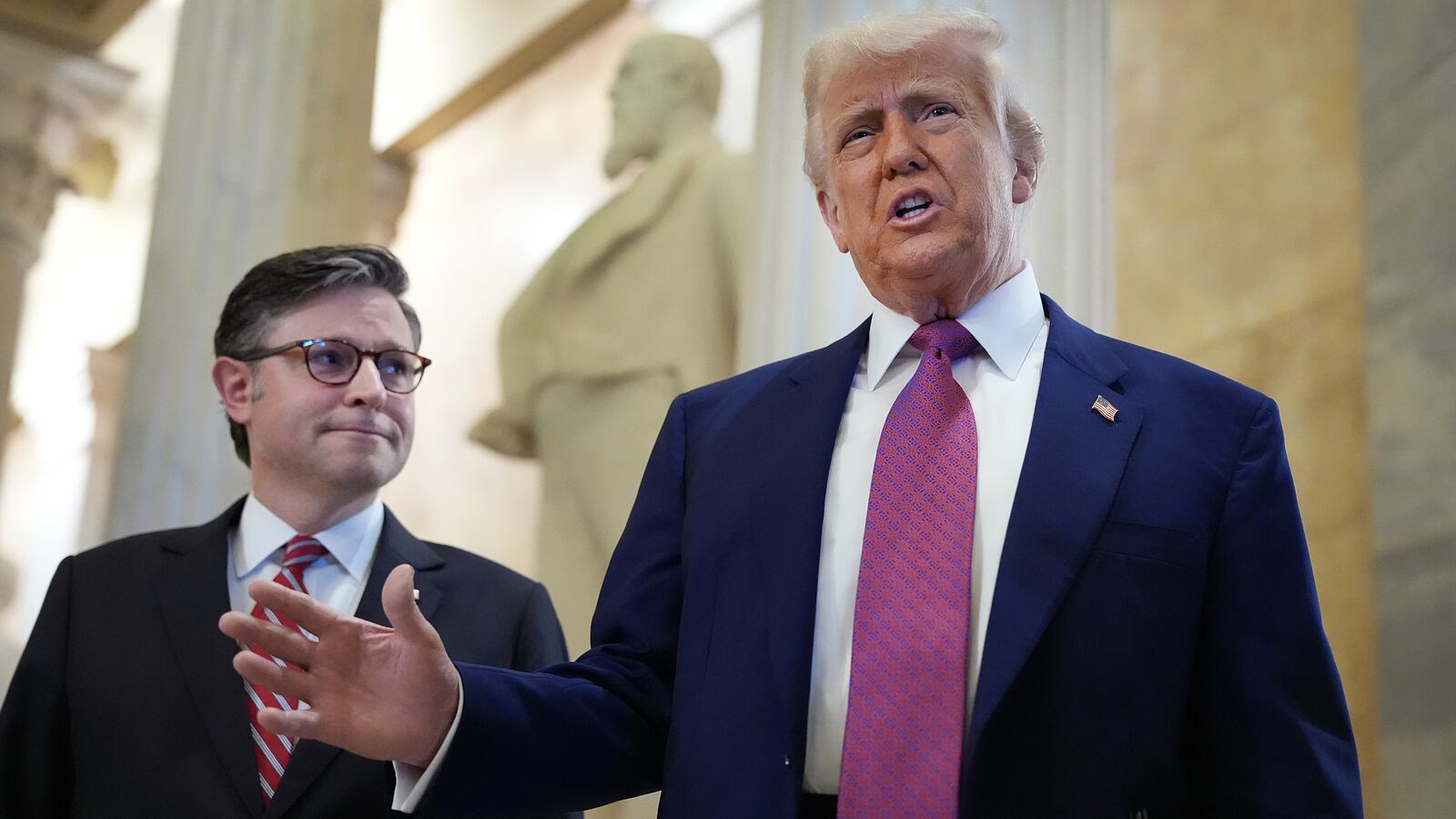 President Donald Trump arrives with Speaker of the House Mike Johnson for a House Republican meeting at the U.S. Capitol on May 20, 2025 as he pushes members to pass his massive bill.