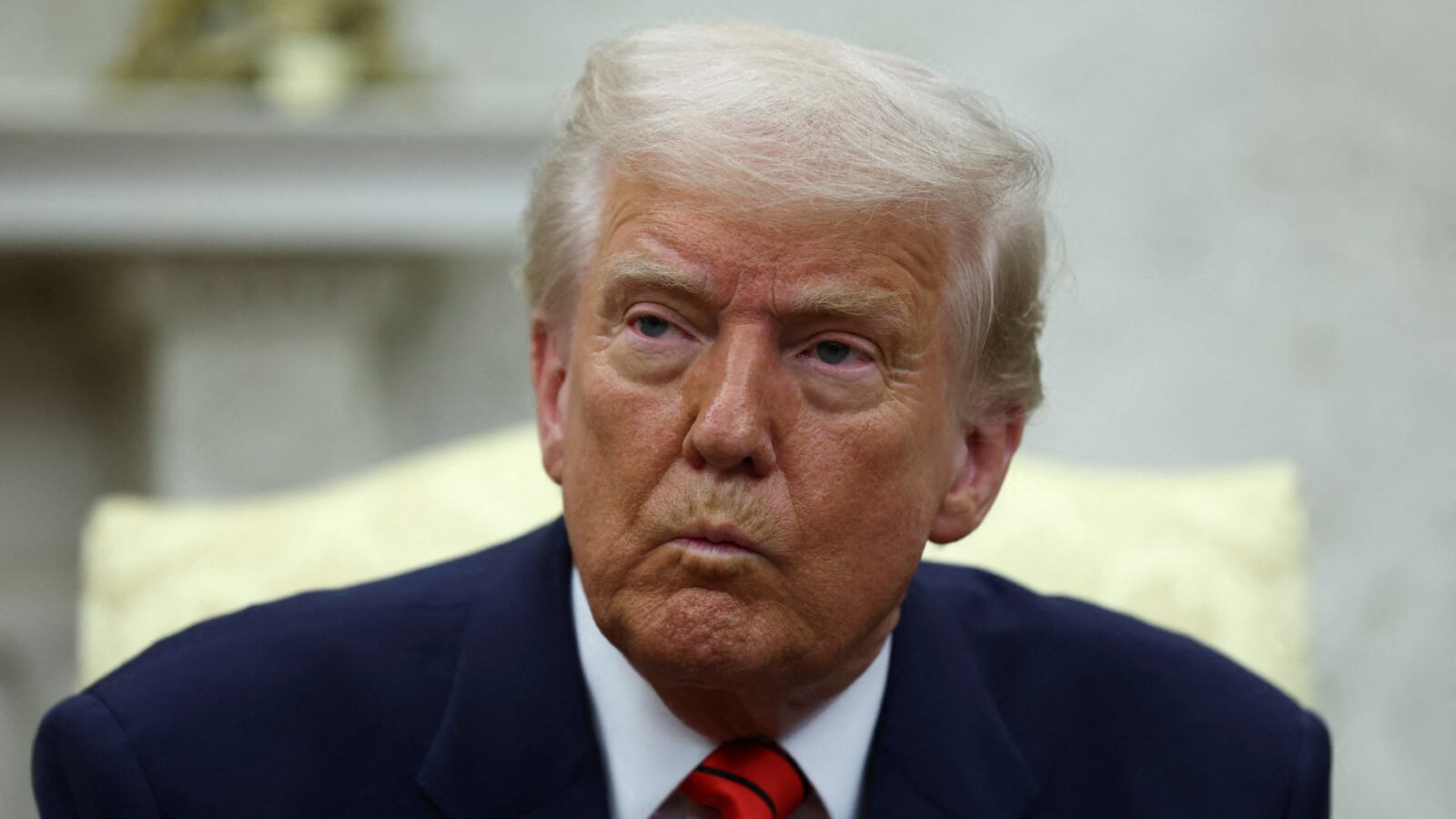 U.S. President Donald Trump reacts as he meets NATO Secretary General Mark Rutte (not pictured), in the Oval Office at the White House in Washington, D.C., U.S., March 13, 2025. REUTERS/Evelyn Hockstein