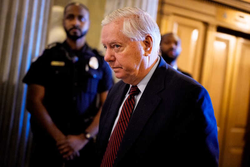 Sen. Lindsey Graham (R-SC) walks into the Senate Chamber on December 11, 2025 in Washington, DC. Two opposing health care bills intended to avert rising health care premiums have failed.