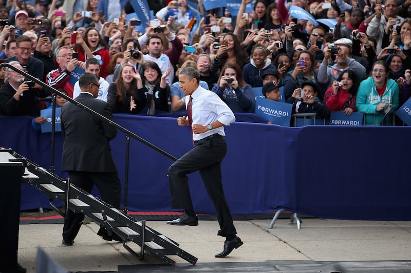 NASHUA, NH - OCTOBER 27:  U.S. President Barack Obama runs up stairs to the stage during a campaign rally at Elm Street Middle School October 27, 2012 in Nashua, New Hampshire. With ten days before the presidential election, Obama and his opponent, former Massachusetts Gov. Mitt Romney are criss-crossing the country from one swing state to the next in an attempt to sway voters.  (Photo by Chip Somodevilla/Getty Images)