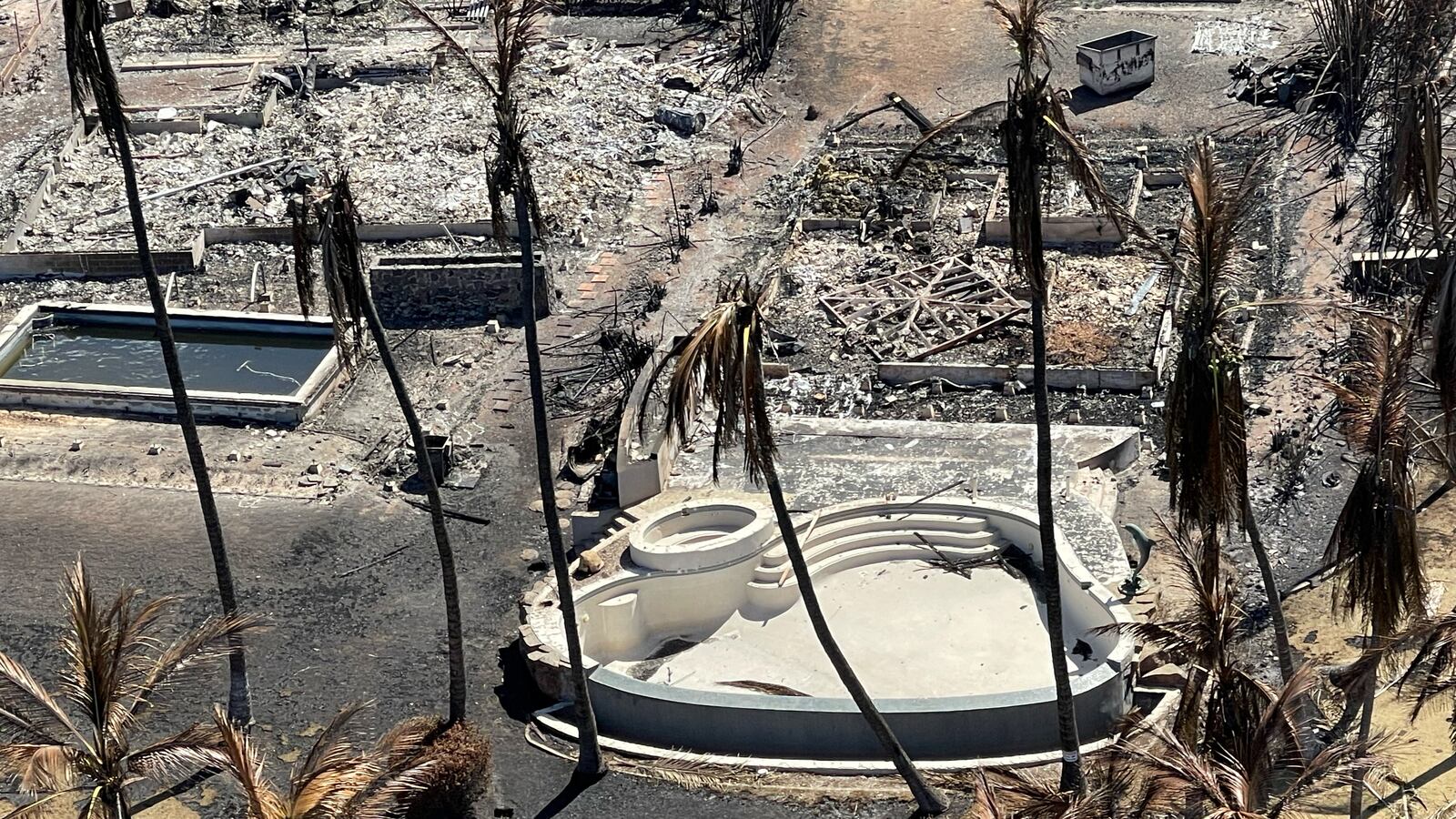 The shells of burned houses, buildings and a pool in Lahaina, Maui, Hawaii.
