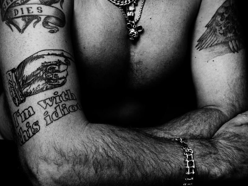 galleries/2011/08/31/garage-magazines-tattoo-spread-damien-hirst-and-more/garage-magazine-dInos-chapman_lqiues