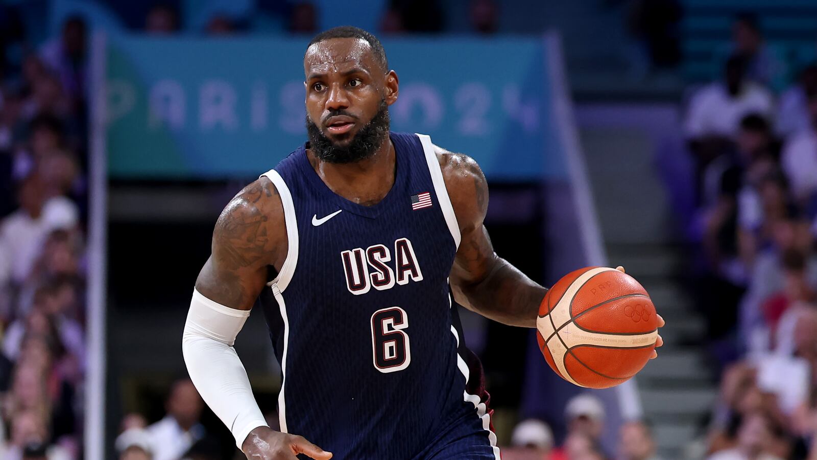 LeBron James #6 of Team United States drives to the basket against Team Serbia during the second half of the Men's Group Phase - Group C game between Serbia and the United States on day two of the Olympic Games Paris 2024 at Stade Pierre Mauroy on July 28, 2024 in Lille, France.