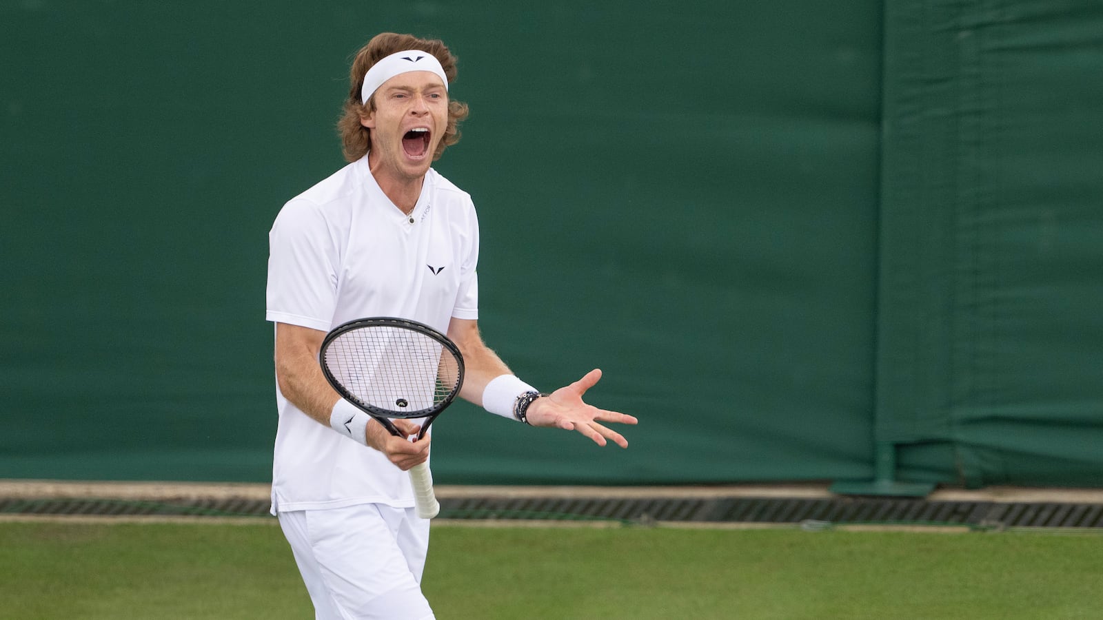 Andrey Rublev reacts to a point during his match against Francisco Comesana of Argentina on day two of The Championships at All England Lawn Tennis and Croquet Club.