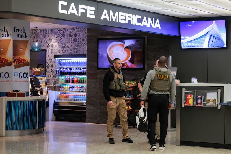 DULLES, VIRGINIA - MARCH 24: Immigration and Customs Enforcement (ICE) agents patrol Dulles International Airport on March 24, 2026 in Dulles, Virginia. The travel disruptions continue as hundreds of TSA agents quit or work without pay during a partial government shutdown. U.S. President Donald Trump deployed ICE agents to U.S. airports on Monday, with border czar Tom Homan in charge of the effort. (Photo by Heather Diehl/Getty Images)