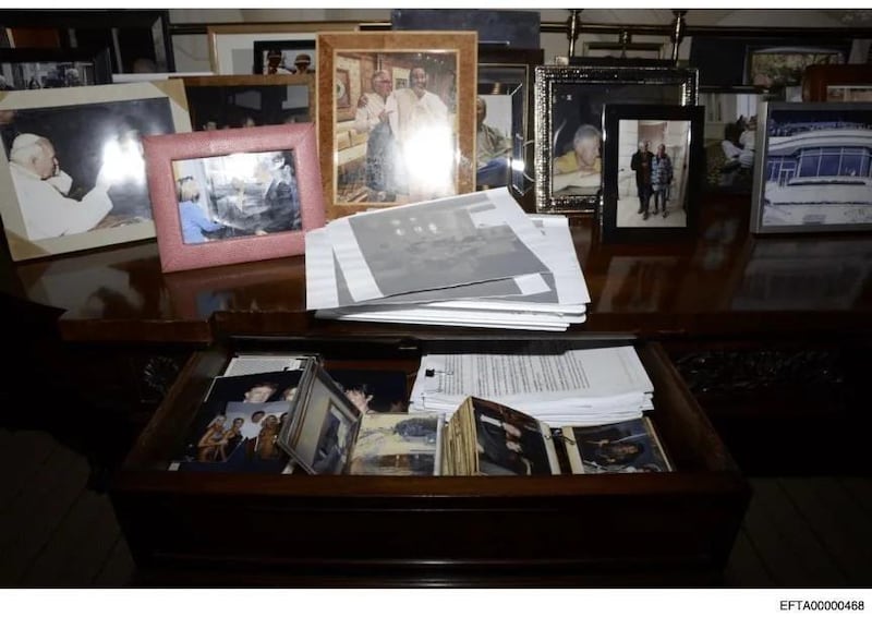 Epstein's desk featuring a picture of Trump and Epstein.