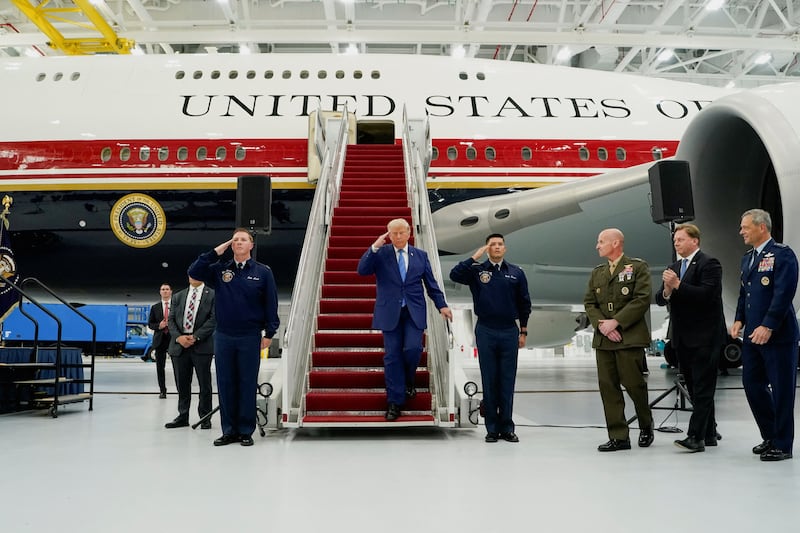 U.S. President Donald Trump salutes as he tours the VC-25B aircraft gifted by Qatar that will be used as Air Force One, at Joint Base Andrews, Maryland, U.S., June 19, 2026.