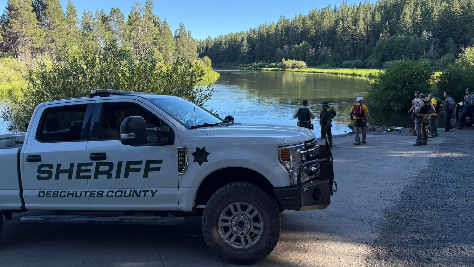 An emergency response vehicle on the banks of the Deschutes River.