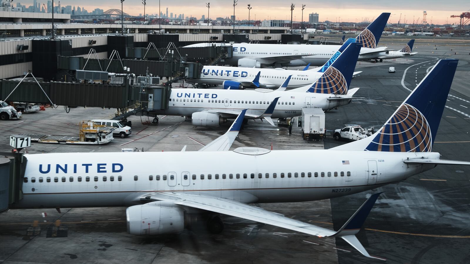 Passengers had to leave a United Airlines plane via slides after black smoke could be seen gushing out of an engine.