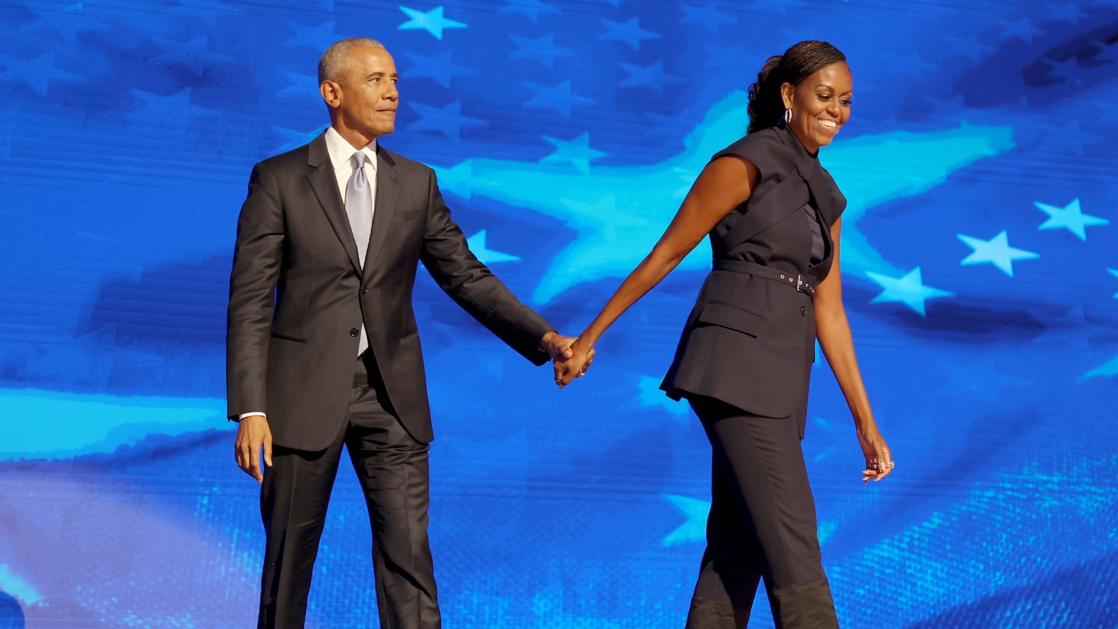 DNC CHICAGO, IL AUGUST 20, 2024 Former President Barack Obama and former first lady Michelle Obama on stage during the Democratic National Convention Tuesday, Aug. 20, 2024, in Chicago. (Robert Gauthier/Los Angeles Times via Getty Images)