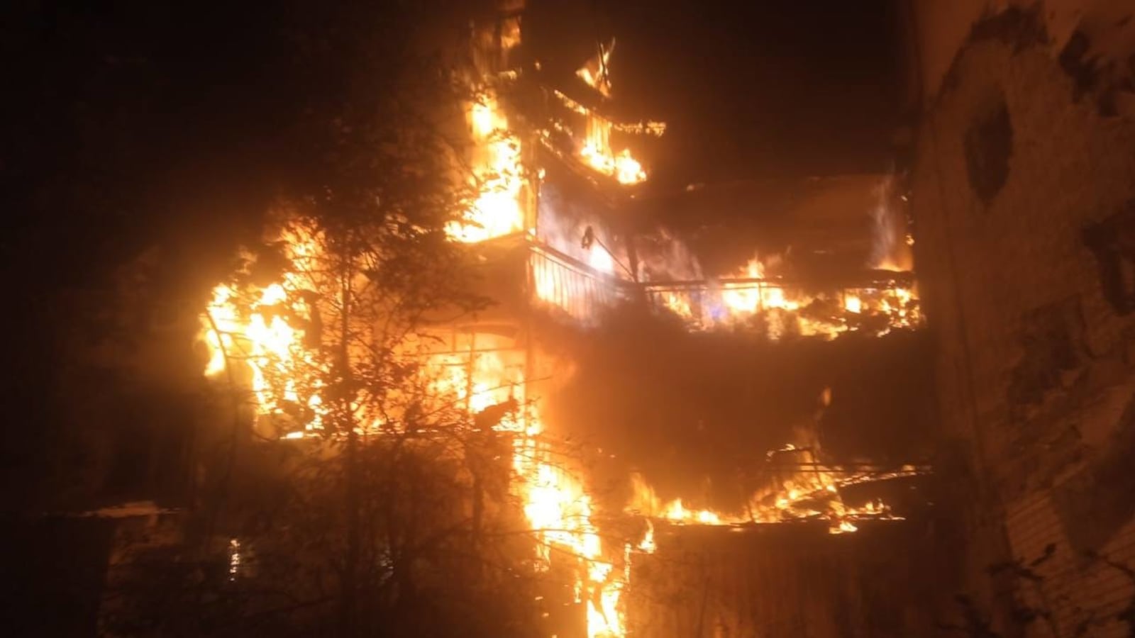 A residential building burns in Kherson, Ukraine, after being hit by Russian shelling.