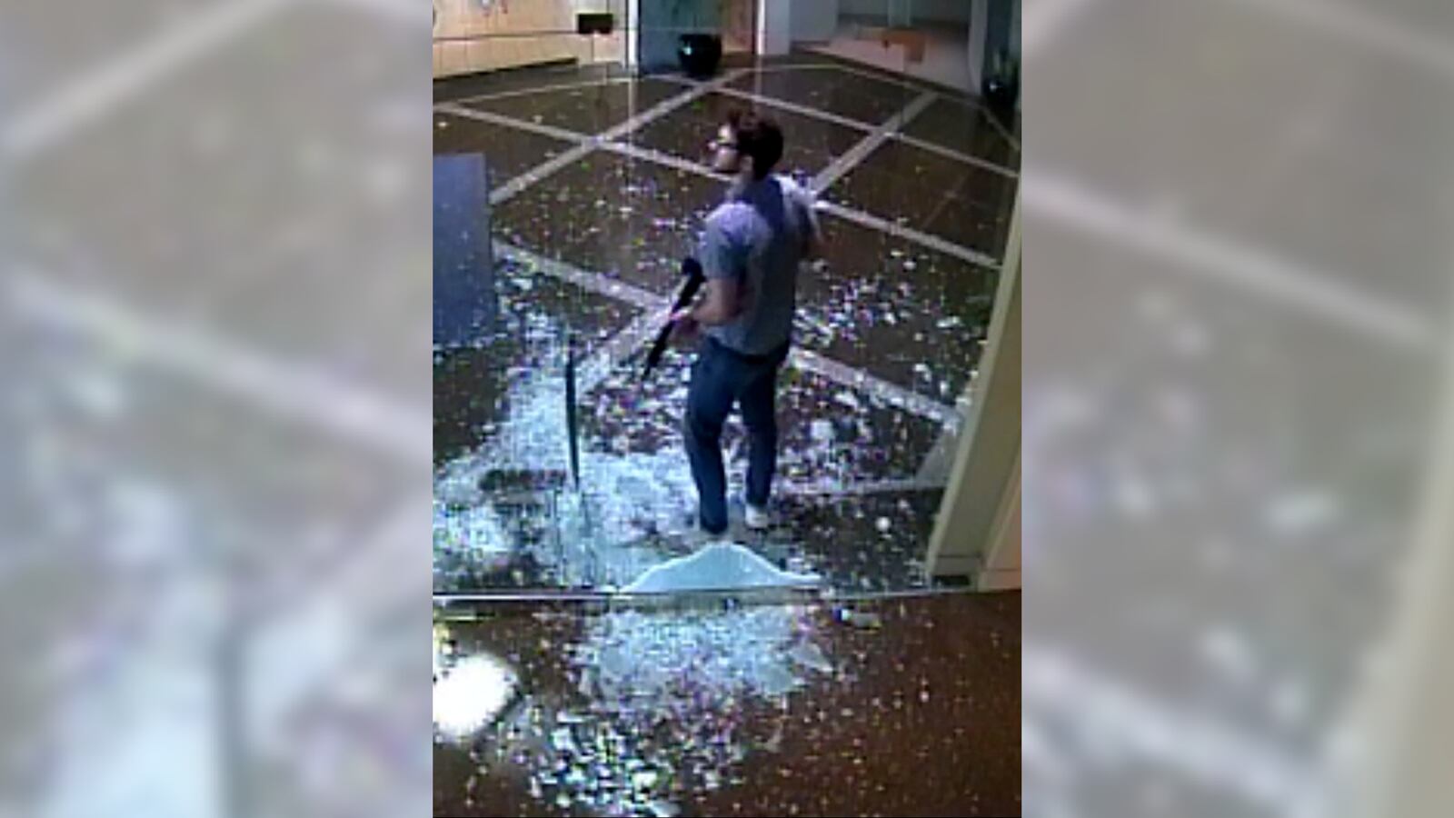 Connor Sturgeon standing on broken glass in the bank.