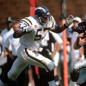 Todd Christensen #46 of the Los Angeles Raiders catches a pass over Keith Browner #57 of the San Diego Chargers during an NFL football game September 4, 1988 at the Los Angeles Memorial Coliseum in Los Angeles, California. Christensen played for the Raiders from 1979-88.