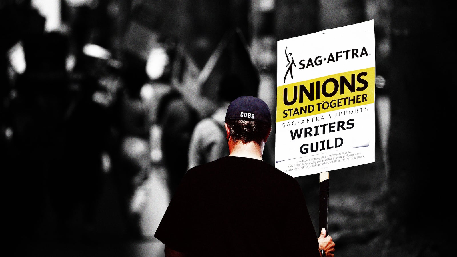 An illustration including a SAG-AFTRA member holding a sign that reads Unions Stand Together during WGA Strike.