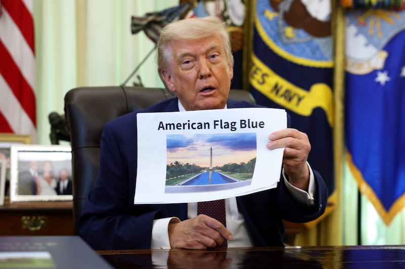 WASHINGTON, DC - JUNE 03: U.S. President Donald Trump displays a rendering of his proposed renovations to the Lincoln Memorial Reflecting Pool during an event in the Oval Office of the White House on June 03, 2026 in Washington, DC. The landmark is being painted as part of President Trump's efforts to repair Washington D.C. in preparation for the Nation's 250th birthday. (Photo by Kevin Dietsch/Getty Images)