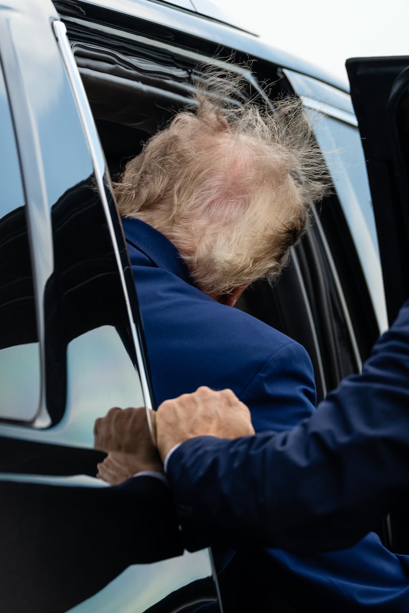 Donald Trump enters an SUV after arriving on Air Force One at Newark Liberty International Airport