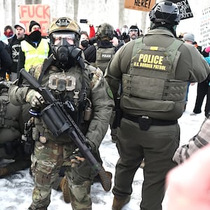 Protestors clash with federal agents outside the Bishop Henry Whipple Federal Building in Saint Paul, Minnesota