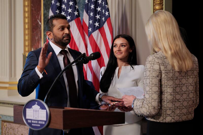 WASHINGTON, DC - FEBRUARY 21: U.S. Attorney General Pam Bondi swears in the new Federal Bureau of Investigation Director Kash Patel as his girlfriend Alexis Wilkins holds the Bhagavad Gita in the Indian Treaty Room in the Eisenhower Executive Office Building on February 21, 2025 in Washington, DC. Patel was confirmed by the Senate 51-49, with Sen. Susan Collins (R-ME) and Sen. Lisa Murkowski (R-AK) the only Republicans voting to oppose him. Patel has been a hard-line critic of the FBI, the nation’s most powerful law enforcement agency. (Photo by Chip Somodevilla/Getty Images)