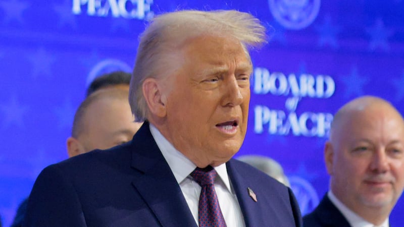 DAVOS, SWITZERLAND - JANUARY 22: U.S. President Donald Trump presents the “Board of Peace” onstage at the World Economic Forum (WEF) on January 22, 2026 in Davos, Switzerland. The annual meeting of political and business leaders comes amid rising tensions between the United States and Europe over a range of issues, including Trump's vow to acquire Greenland, a semi-autonomous Danish territory. (Photo by Chip Somodevilla/Getty Images)