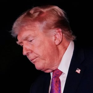 U.S. President Donald Trump reacts as he walks after exiting Marine One on the South Lawn while returning to the White House in Washington, D.C., U.S., April 17, 2026.