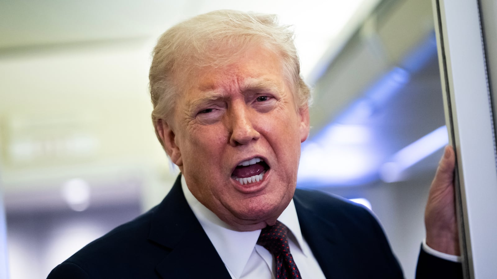IN FLIGHT - MARCH 15: U.S. President Donald Trump speaks to members of the media onboard Air Force One on March 15, 2026 while en route to Joint Base Andrews, Maryland from West Palm Beach Florida. President Trump returned to Washington D.C. on Sunday following a weekend trip to Florida. (Photo by Nathan Howard/Getty Images)