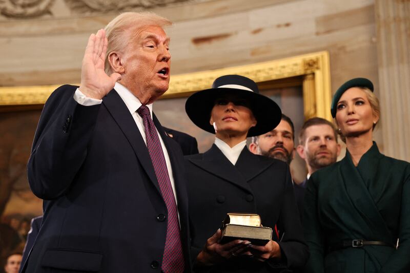 U.S. President-elect Donald Trump takes the oath of office as Melania Trump, Ivanka Trump, Donald Trump Jr. and Eric Trump look on during inauguration ceremonies in the Rotunda of the U.S. Capitol on January 20, 2025 in Washington, DC. Donald Trump takes office for his second term as the 47th president of the United States. (Photo by Chip Somodevilla / POOL / AFP) (Photo by CHIP SOMODEVILLA/POOL/AFP via Getty Images)