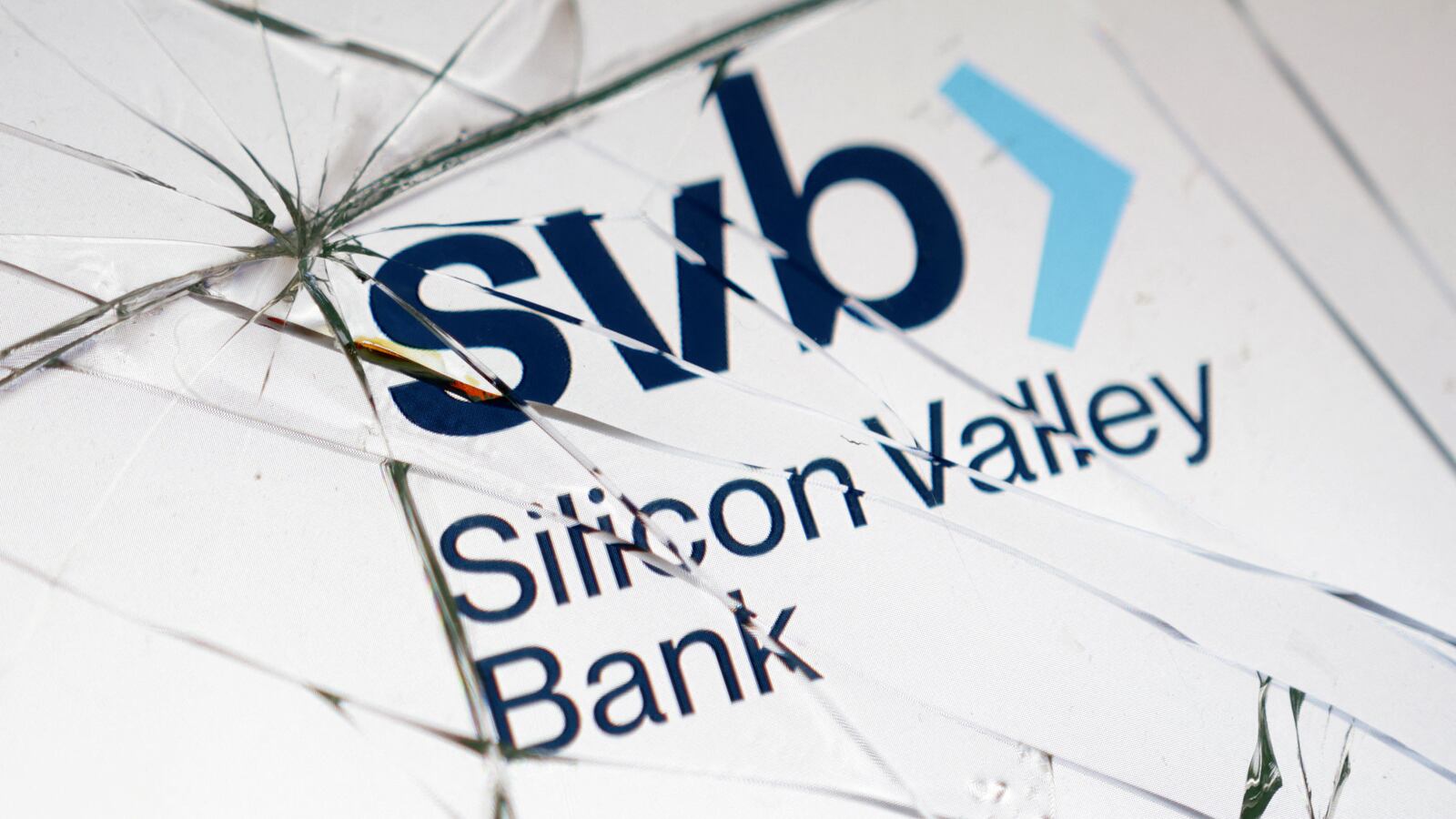 Silicon Valley Bank (SVB) logo is seen through broken glass in this picture illustration taken March 16, 2023.