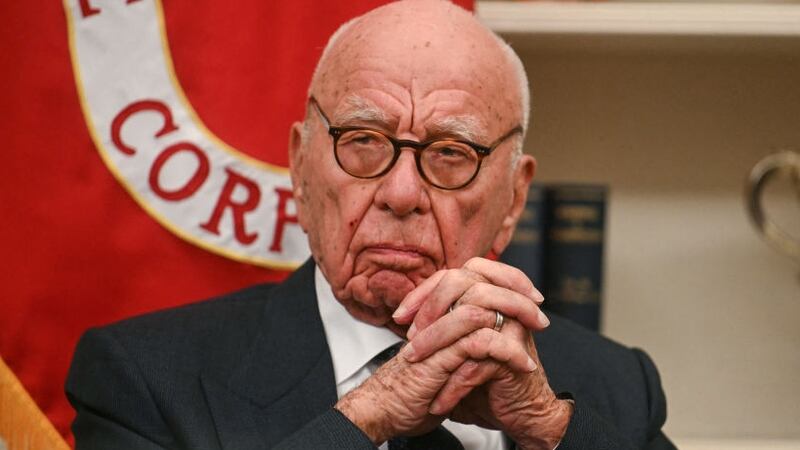 Rupert Murdoch looks as US President Donald Trump speaks to the press after signing an executive order to create a US sovereign wealth fund, in the Oval Office of the White House on February 3, 2025, in Washington, DC. (Photo by Jim WATSON / AFP) (Photo by JIM WATSON/AFP via Getty Images)