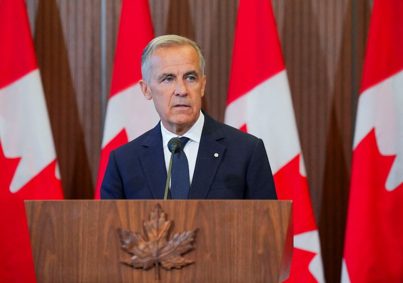 Canadian Prime Minister Mark Carney speaks with the news media after he suspended trade negotiations with the United States, in Ottawa, Ontario, Canada August 22, 2026.