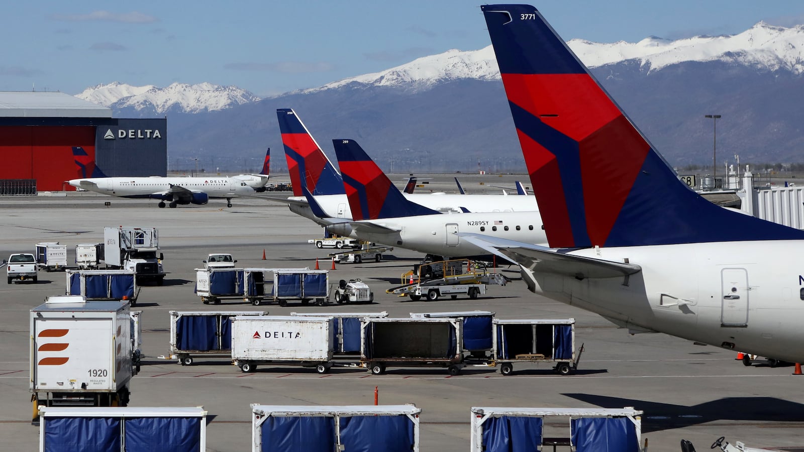Delta Airlines planes are loaded and unloaded as travel has cutback amid concerns of the coronavirus disease (COVID-19), at Salt Lake City International Airport in Salt Lake City, Utah, U.S. April 14, 2020.