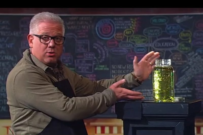 articles/2012/11/29/glenn-beck-s-obama-pee-stunt-shows-he-s-still-in-populist-huckster-game/glenn-beck-obama-urine-jar-moynihan-tease_adpiil