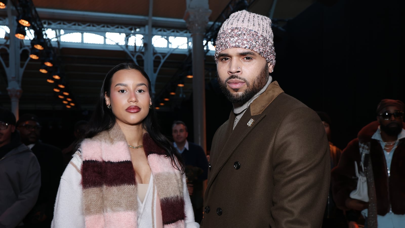 Jada Wallace and Chris Brown attend the Amiri Menswear Fall/Winter 2026-2027 show as part of Paris Fashion Week on January 22, 2026 in Paris, France.