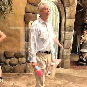 Sen. Lindsey Graham walking with a bubble wand at Disney World. *Permission granted by TMZ to use*