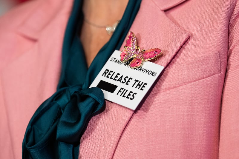 Danielle Bensky, a Jeffrey Epstein survivor, wears a pin during a news conference ahead of the State of the Union address on Tuesday.